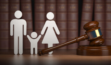Various Roles Of A Child Support Lawyer - Familty law. Gavel and shapes of men, women and child with books